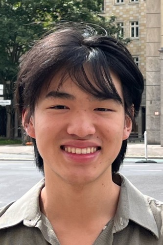 Headshot of young man looking directly at camera.