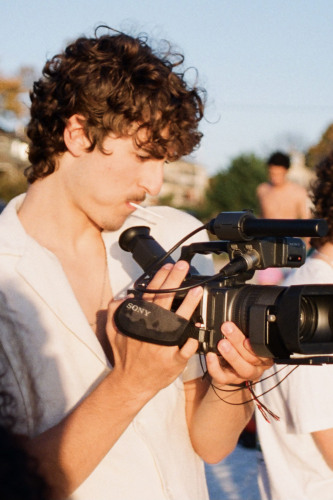 Young man holding a camera