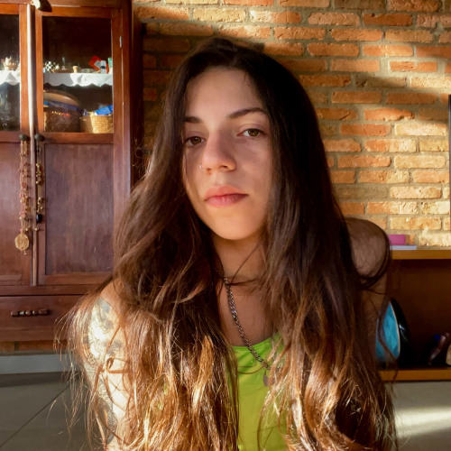 Photo of woman, looking directly at camera. 